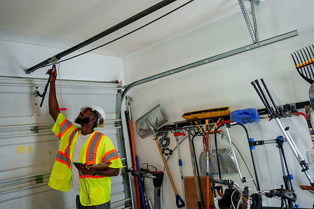 Professional Garage Door Repair technician working in Norwood, NY